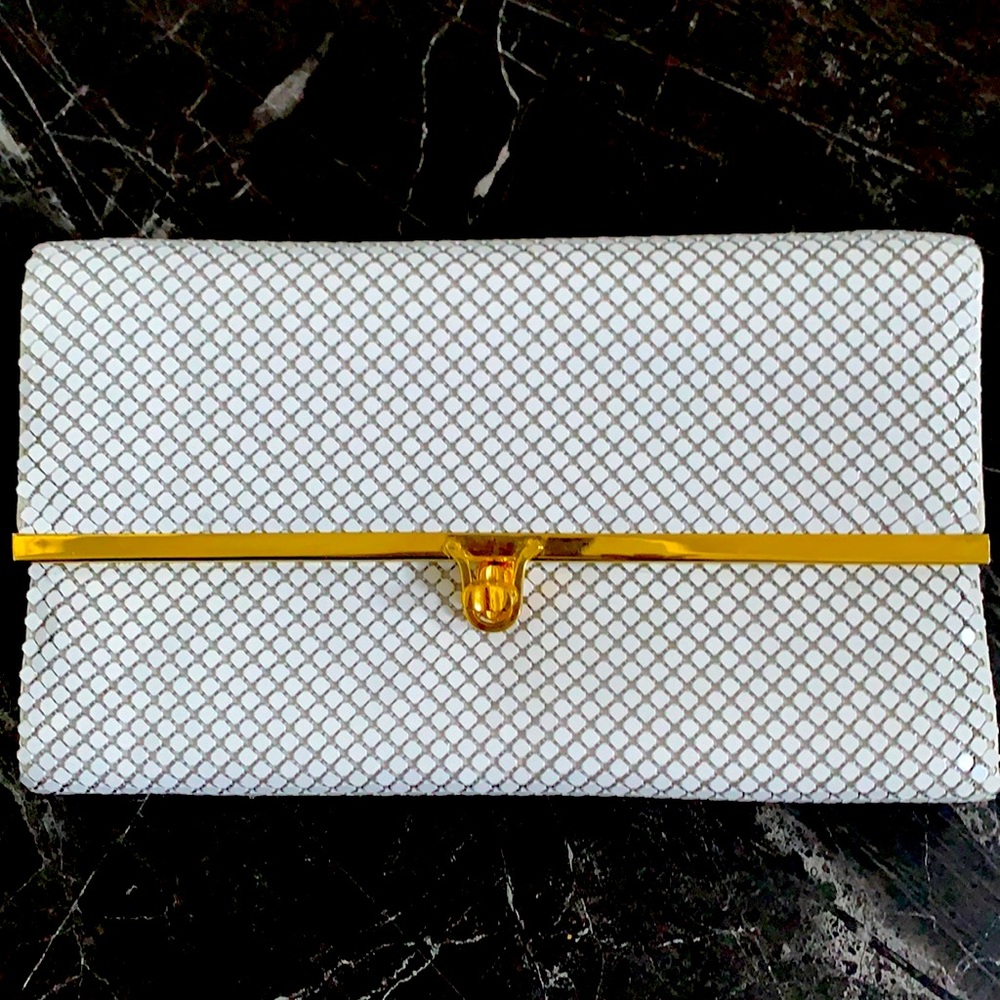 Mesh clutch bag with strap and clasp closure